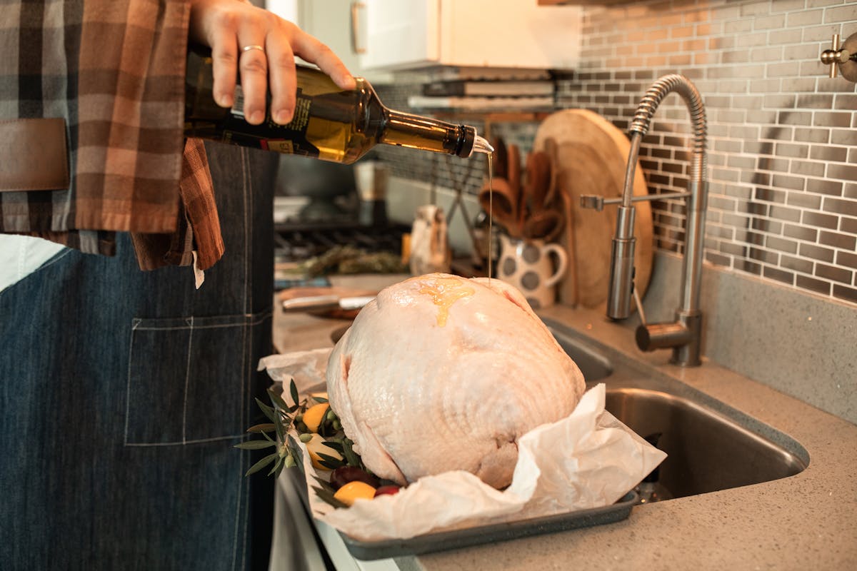 Whole roasted turkey prepared for a Thanksgiving table, the finish line of a proper multi-day fridge thaw timeline